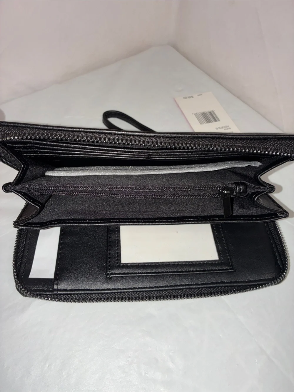 Betsey Johnson Black Wristlet Clutch with Embossed Skull Motif